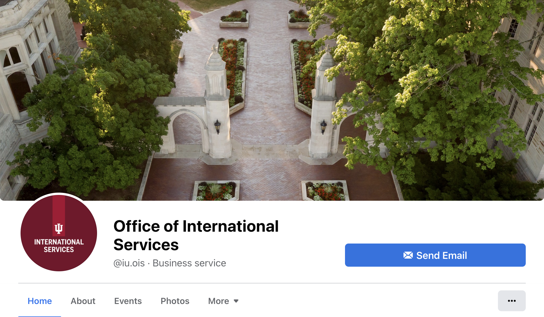 A picture of the IU Office of International Services Facebook page featuring the account's information and an aerial photo of the Sample Gates