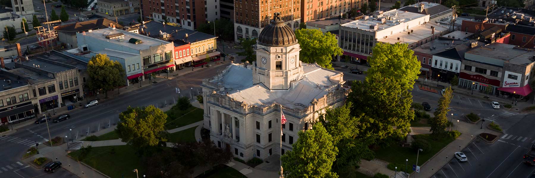 Aerial photo of the Monroe County Courthouse and surrounding shops on the square.
